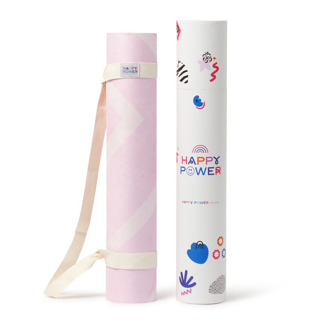 Eco friendly exercise and yoga mat rolled up with bonus carry strap. Mat features Pale pink design with alternating parallel lighter pink lines.